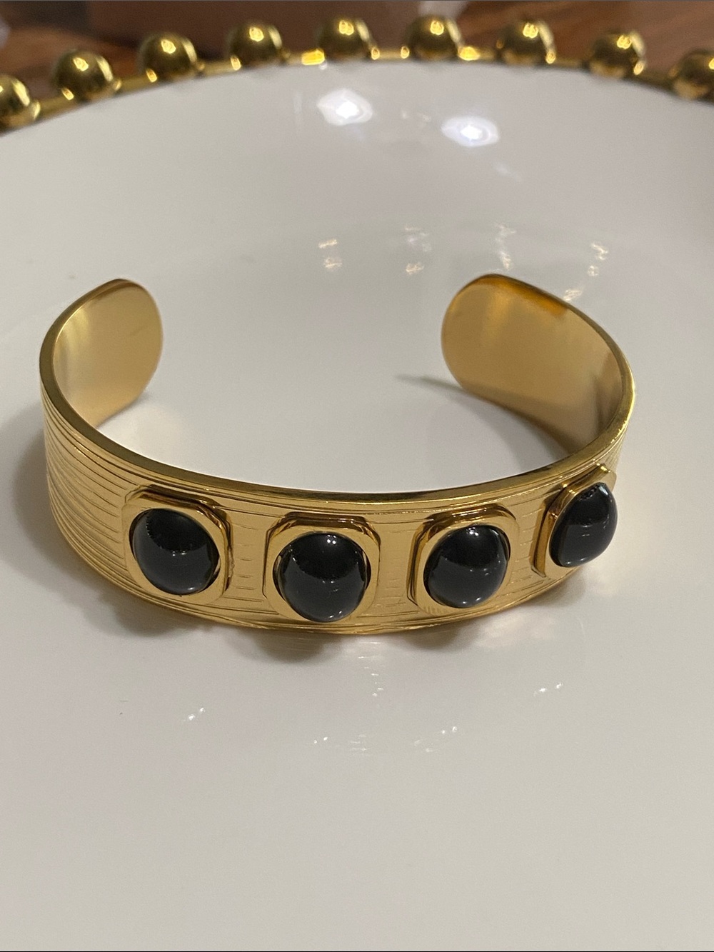 Gold Cuff Bracelet with Black Cabochons